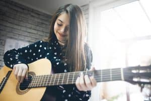 Girl playing guitar